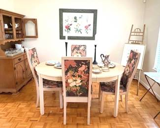 Blonde wood dining table and floral upholstery chairs 