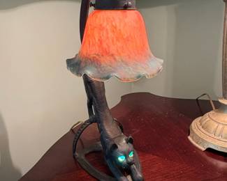 Vintage Cast Iron Crouching Cat Lamp with Glowing Green Eyes and Iridescent Glass Shade third image