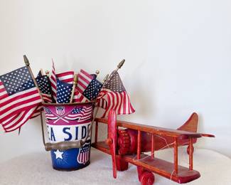 vintage wooden red biplane and mini american flags