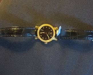 Women’s Movado gold and diamond watch 