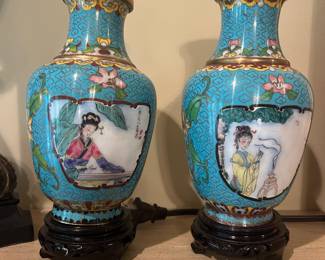 Pair of enamel and bass urns 