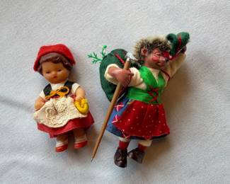 On left, Features traditional Black Forest style clothing including a red skirt, white lace apron and red hat.  On right, vintage Steiff "Micki" hedgehog doll