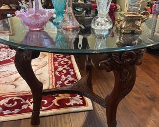 Wood carved rams base with heavy glass top