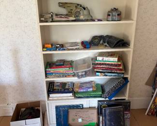 crafting supplies, photo albums and Star Wars toys.  The bookcase is NOT for sale. 