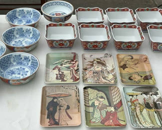 Lot 28: Assorted Asian-style ceramic bowls, decorative boxes, plates, and a round wooden box