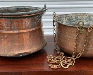 Lot 47: Pair of rustic copper pots with chains