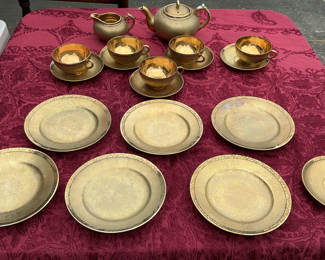 Lot 29: Gold-tone Japanese teapot set with cups, saucers and plates