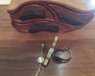 Lot 59: Two watches and a bracelet with a carved wooden box