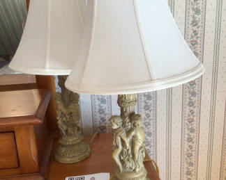 Lot 56: Two ornate sculpted table lamps with fabric shades