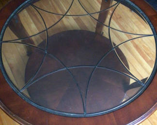 Lot 37: Round glass-top coffee table with wood rim and metal lattice