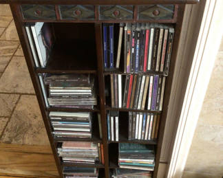 Lot 31: Wooden CD storage cabinet with multiple CD collections