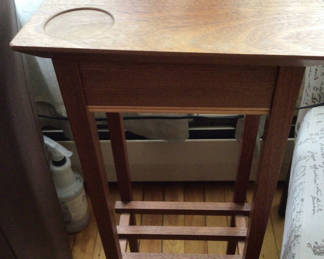 Lot 35: Wooden end table with circular inset and slatted lower shelf