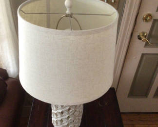 Lot 43: White textured ceramic table lamp with fabric shade