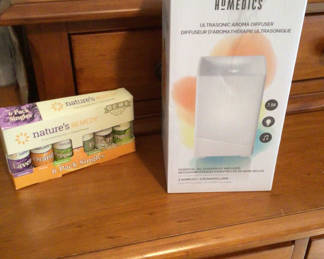 Lot 55: Homedics Ultrasonic Aroma Diffuser and Nature's Remedy Essential Oils