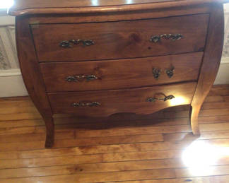 Lot 60: Bombe-style wooden dresser with three drawers