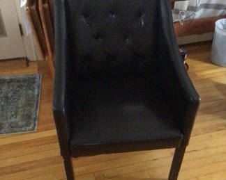 Lot 49: Black tufted armchair