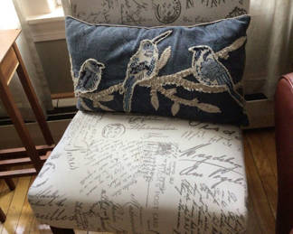 Lot 33: Blue denim embroidered bird pillow on patterned upholstered chair
