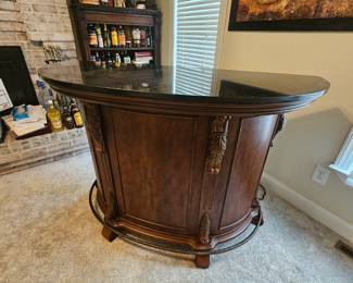  Bourbon Street traditional home bar featuring a black granite top and a cherry wood finish