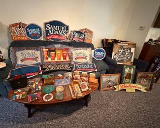 Samuel Adams Signs and Mirrors; Ska Brewing Lighted Sign; Old Milwaukee The Duck Mirror; Budweiser Sign Topper; Genesee Mirror Sign; Miller Mirror Sign; Coffee Table; Ash Trays; Coasters