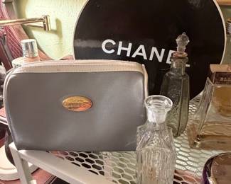Chanel hat box, Christian Dior makeup bag, vintage perfume bottles