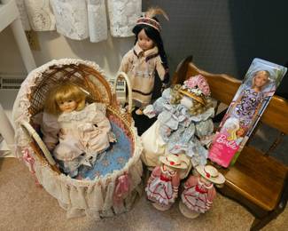 Brinn's 1996 crying baby doll in wicker bassinet 