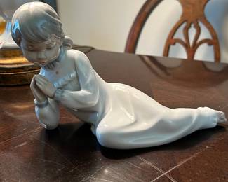 #210	Llardro Daisa statue of a girl praying laying on the ground	 $30.00 			