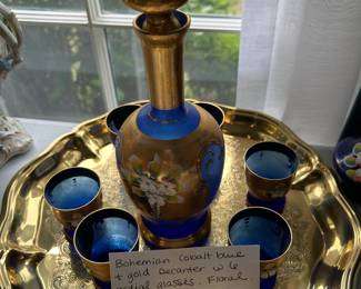 #219	Bohemian Cobalt blue and gold decanter w 6 cordial glasses Floral includes gold tone tray	 $35.00 			
