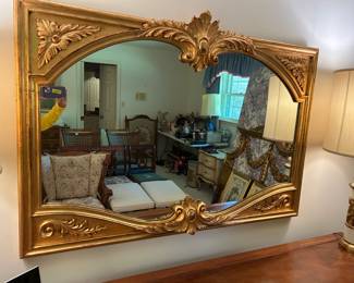 #153	gold mirror painted gold with carving 53x38	 $120.00 			