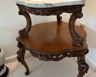 #119	Heavy Carved 2 tiered Table w/wood carved cherubs on legs and 2 top marble piece - 18x28T	 $175.00 			