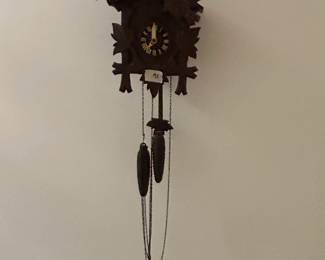 #174	coocoo clock with bird top  and weights 	 $65.00 			