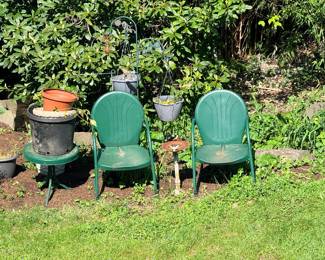 Outdoor chairs and several yard statues and lots of planters - this is just a sample