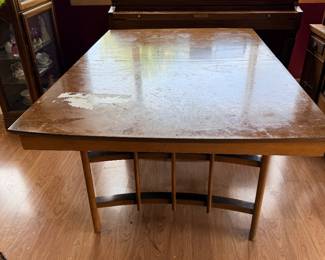 Great Mid-Century Dining set with 4 chairs - 2 extra leaves and folding leaf inside too! Condition as shown - Chairs go with the table - not sold separately.