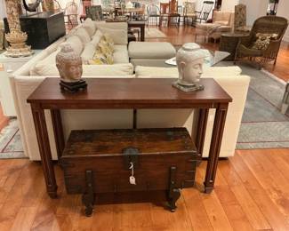 Console table paired with a vintage style wooden storage trunk