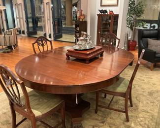 A Large, Polished Oval Dining Table