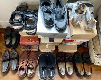 Multiple shoes, many unworn, new-in-box