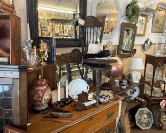dresser, chair, mirrors, framed art