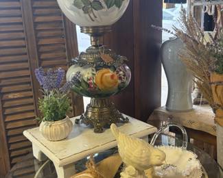 bird figurine, antique lamps, shelves