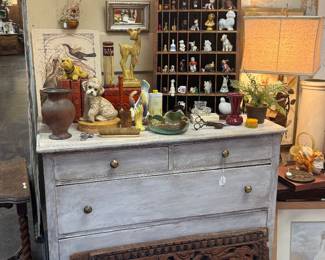 dresser, small collectibles, figurines, framed art