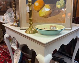 large vintage candlesticks, fruit oil painting, colorful small bowls, white wooden side table