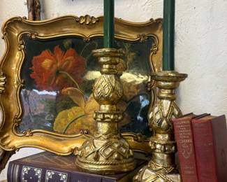 gold candlesticks, framed floral art, vintage books
