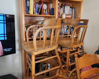 Wood bookcases, wood chairs, books 