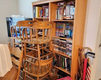 Wood chairs, bookcase, books