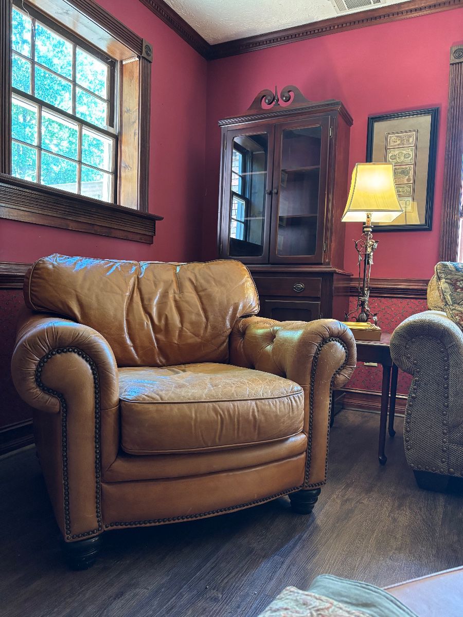 Perfectly worn leather armchair