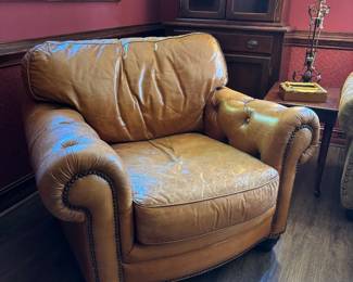 Perfectly worn leather armchair
