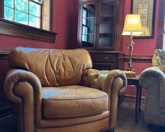 Perfectly worn leather armchair