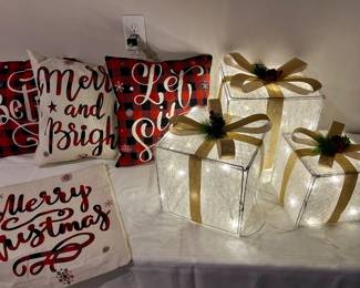 lighted Christmas gifts and pillows