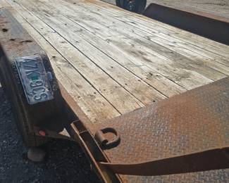 Tilt trailer with ramps