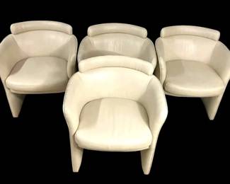 Four Beige Faux Leather Armchairs