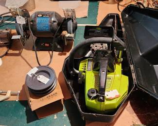 Chainsaw w/ chains and case, 6 in bench grinder, articulating drafting light, NIB pulley, Dutch oven 