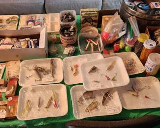 Table of vintage and antique wooden and collectibles lures, tackle boxes, assorted quality fishing tackle